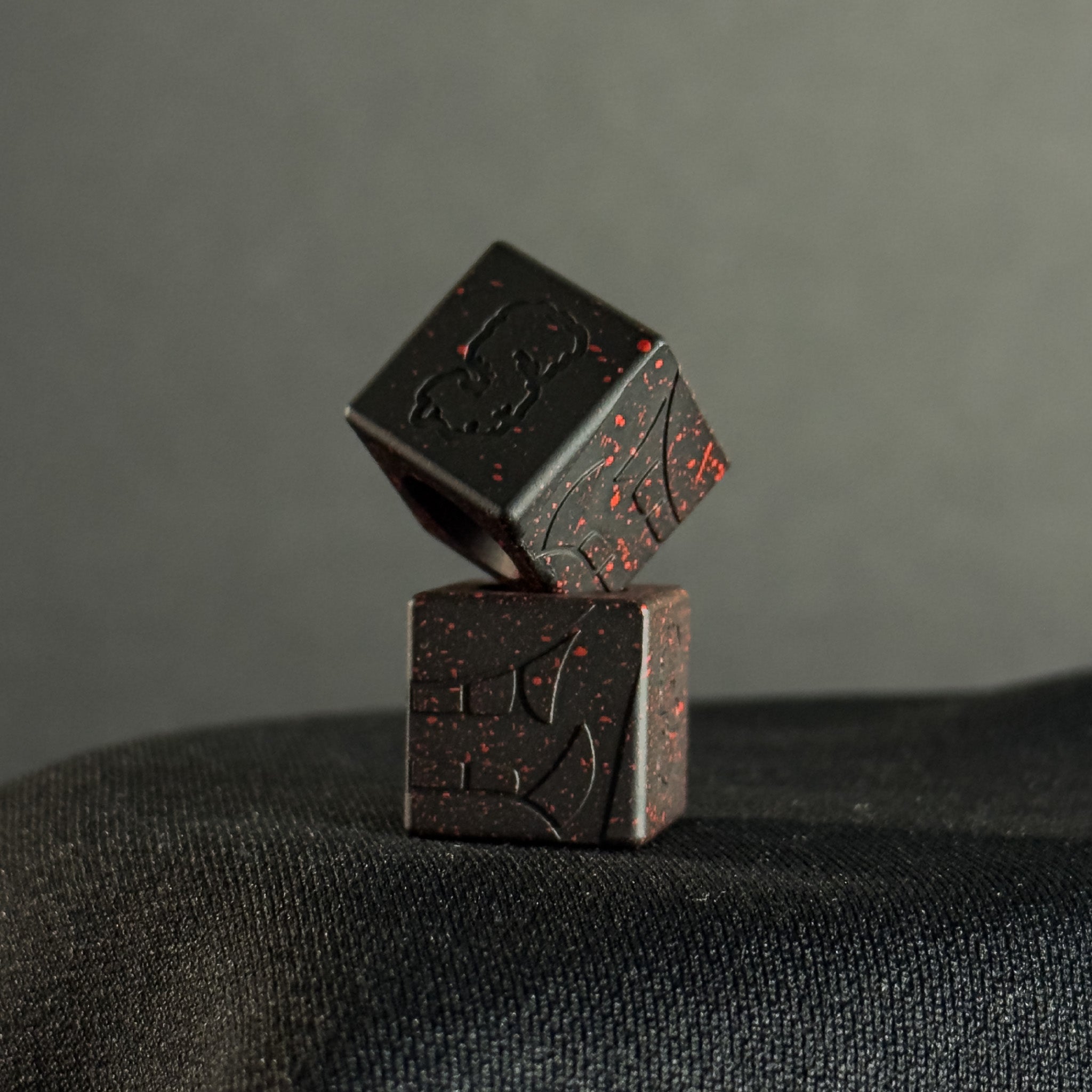 Cube Paracord Bead — Mengu Mempo Pattern in Armor Black/Red Splatter Cerakote