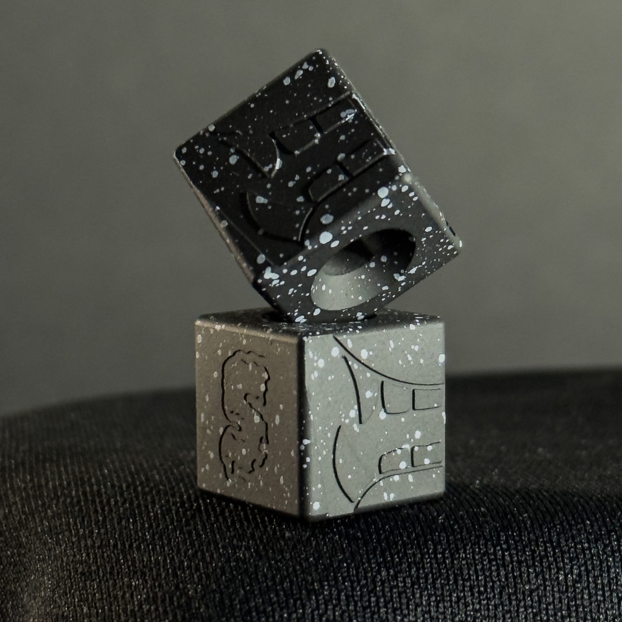 EDC Bead — Cube, Mengu Mempo Pattern in Armor Black/White Splatter Cerakote