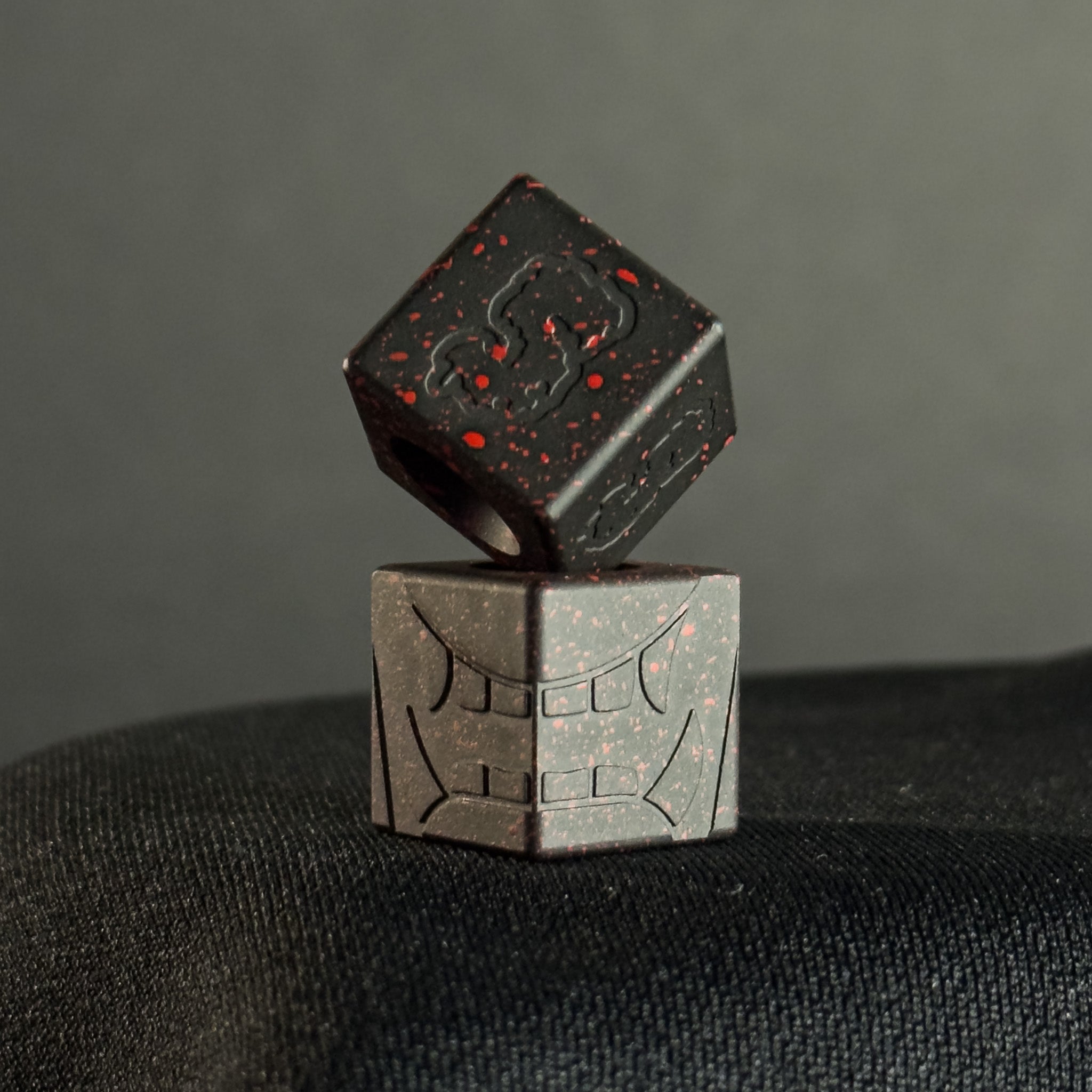 Cube Paracord Bead — Mengu Mempo Pattern in Armor Black/Red Splatter Cerakote